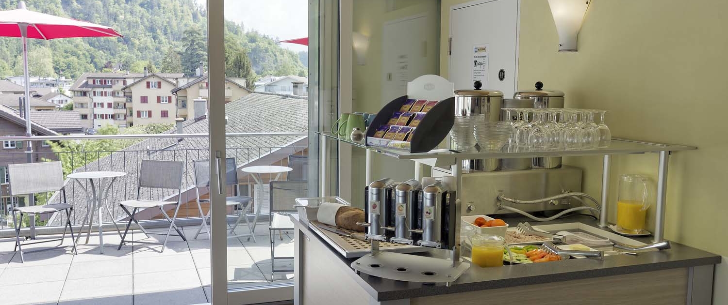 Breakfast buffet with a view of Interlaken Switzerland at Alplodge Hostel - Frühstück mit Aussicht im Alplodge hostel