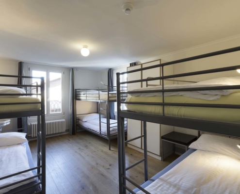 Multiple bed dormitory rooms at Alplodge Hostel Interlaken Switzerland