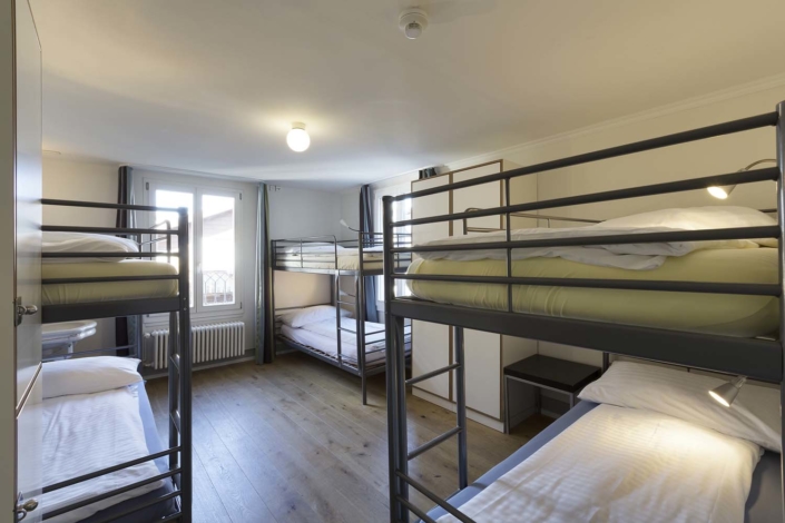 Multiple bed dormitory rooms at Alplodge Hostel Interlaken Switzerland